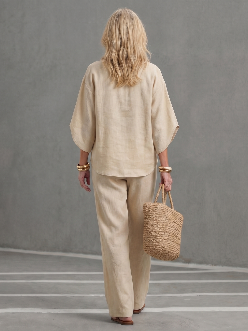 Women's beige button-front tunic and relaxed trousers set, back view