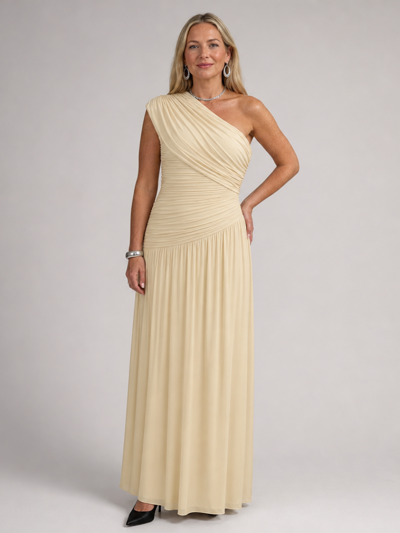 Beige one-shoulder draped maxi dress with gathered bodice and flowing skirt