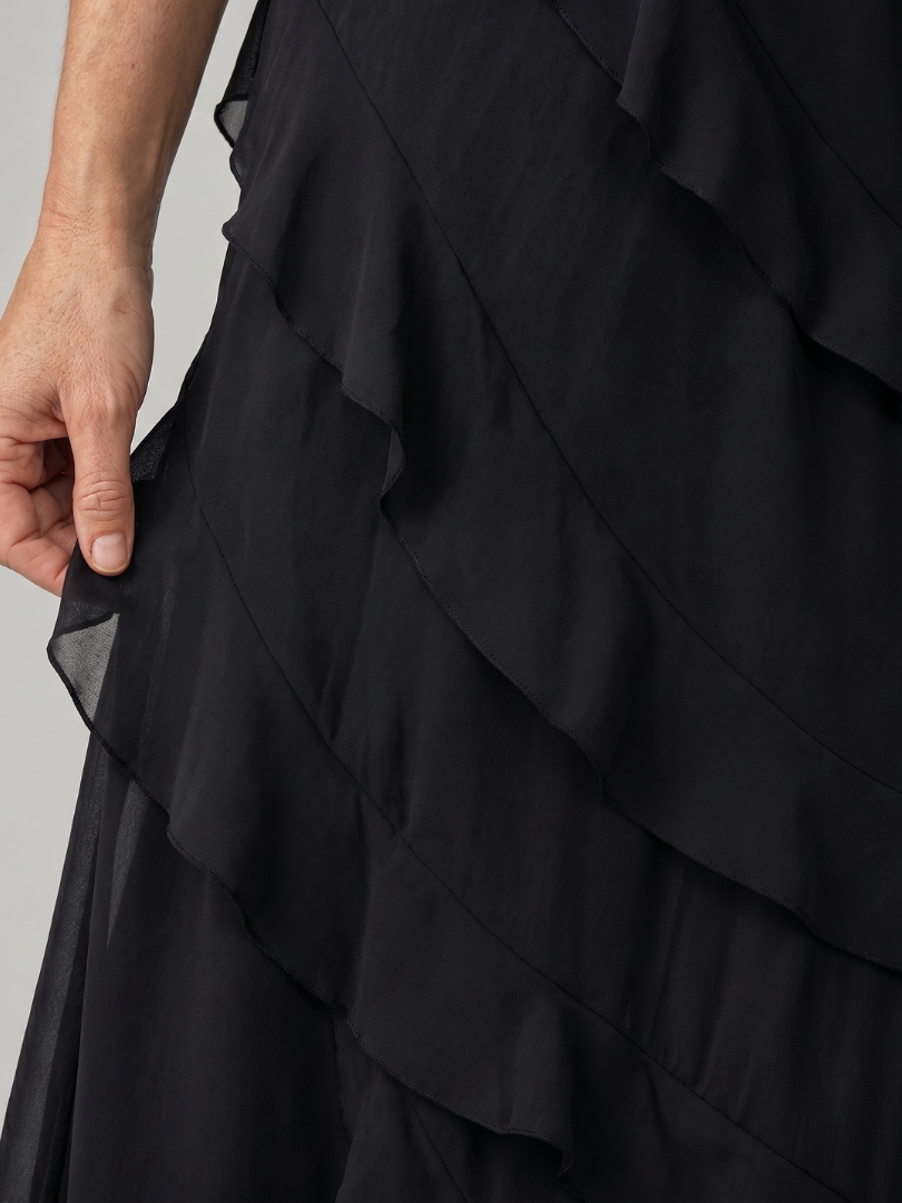 Layered ruffle detail on black spaghetti-strap maxi dress