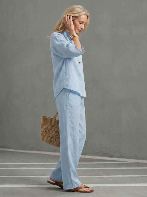 Sky blue button-front tunic with relaxed trousers, side view