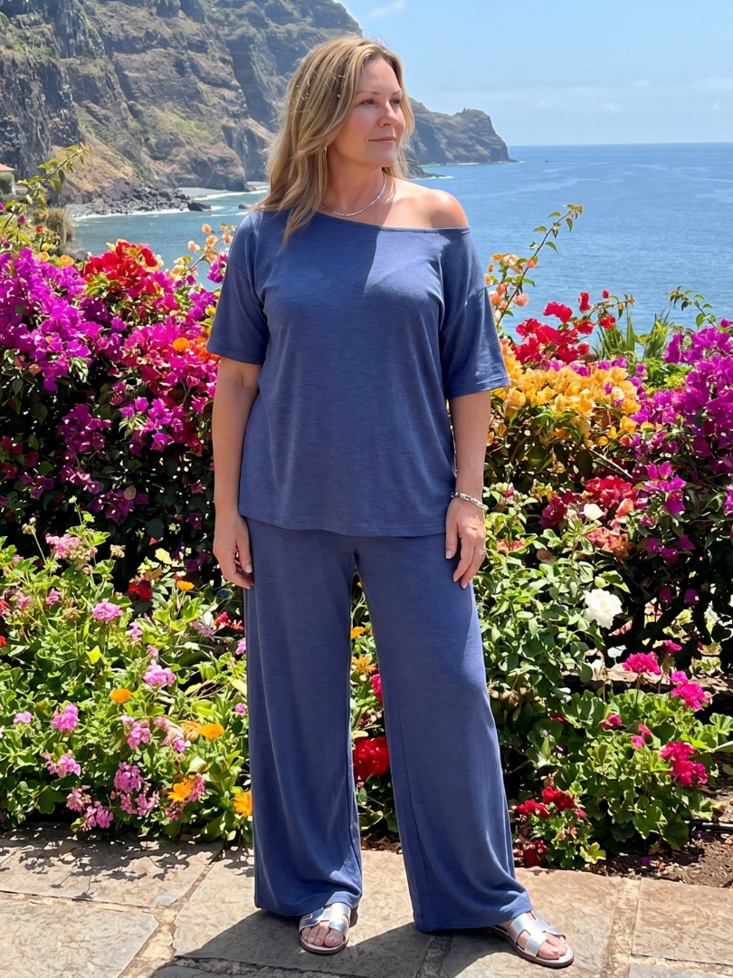 Navy off-shoulder short sleeve top and wide-leg pants set, standing view.