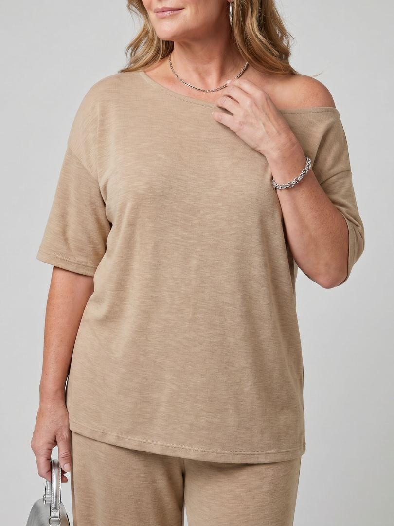 Beige off-shoulder short sleeve top with wide-leg pants, front close-up.