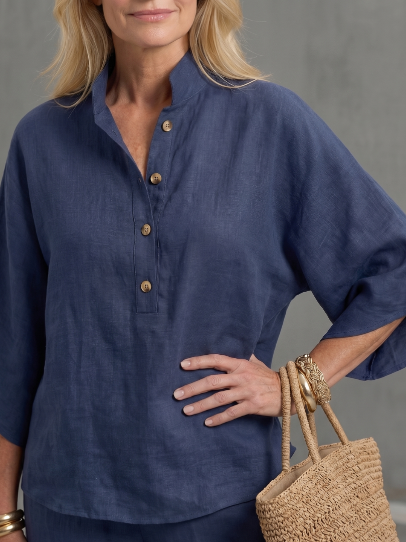 Navy button-front tunic with center placket and round buttons