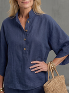 Navy button-front tunic with center placket and round buttons